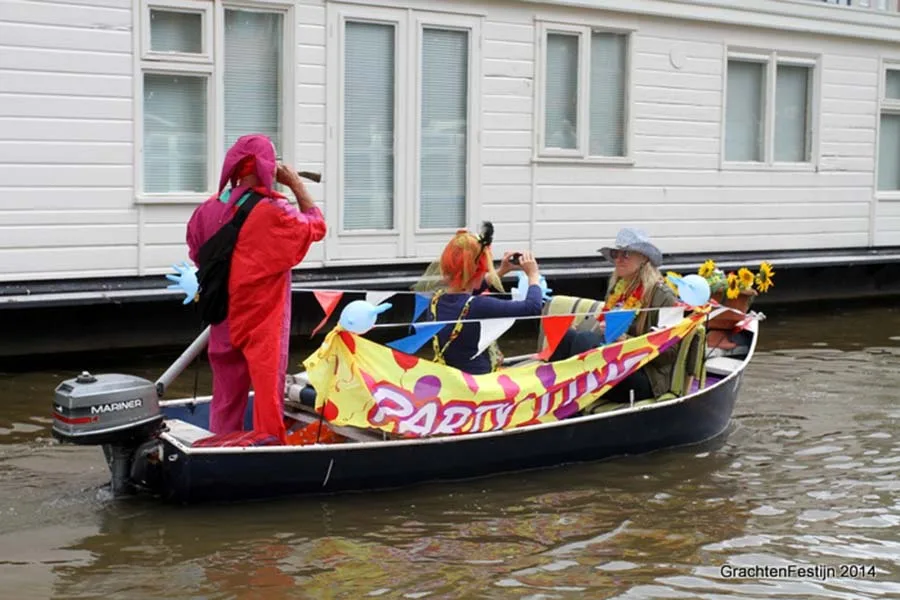 One hundred little boats! The canal parade is alive!